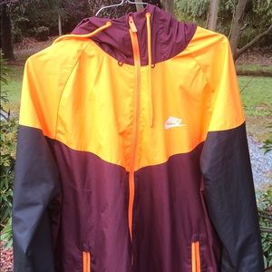 Nike maroon orange black Windbreaker.
